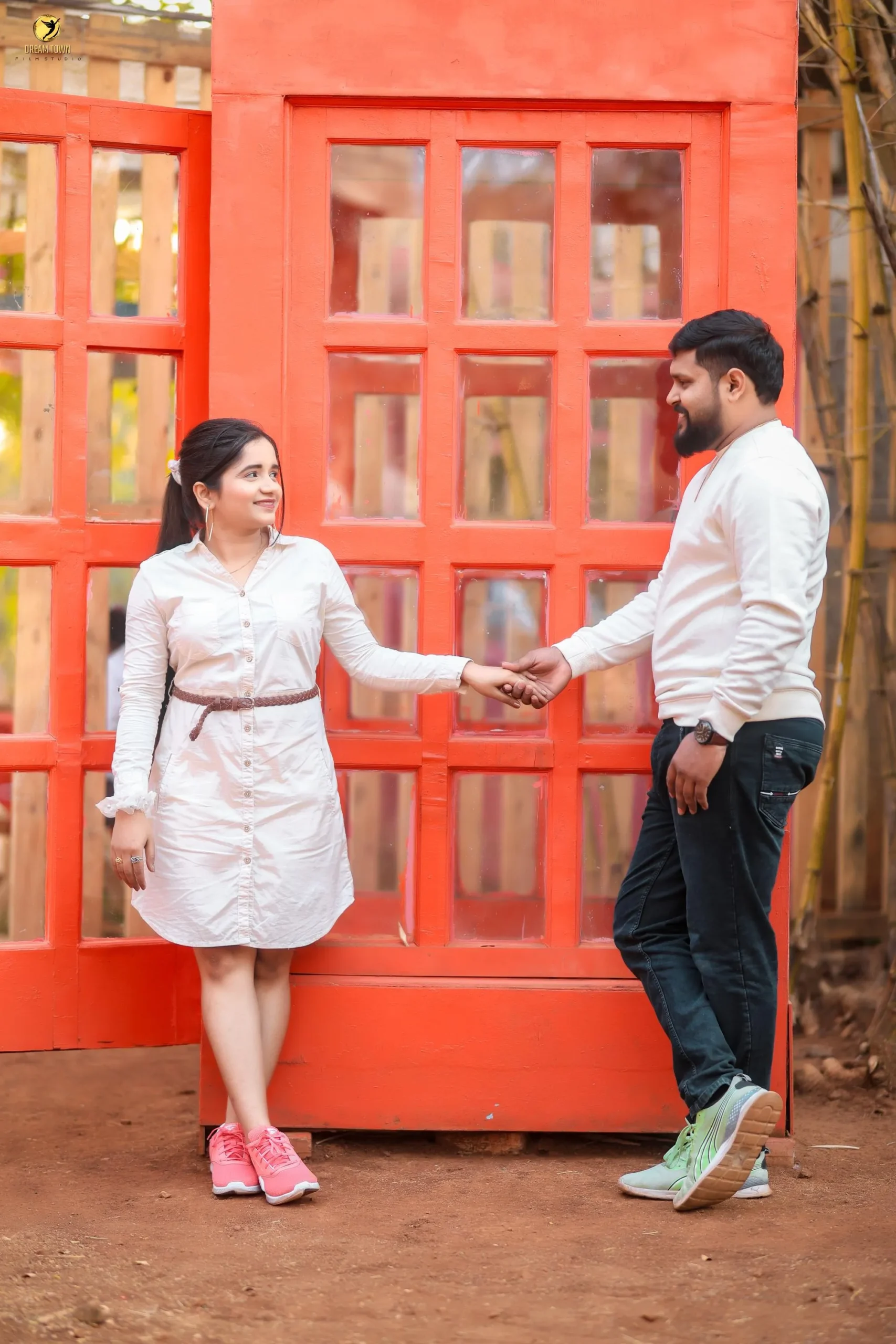 Romantic pre-wedding candid moment at photography studio in Pune