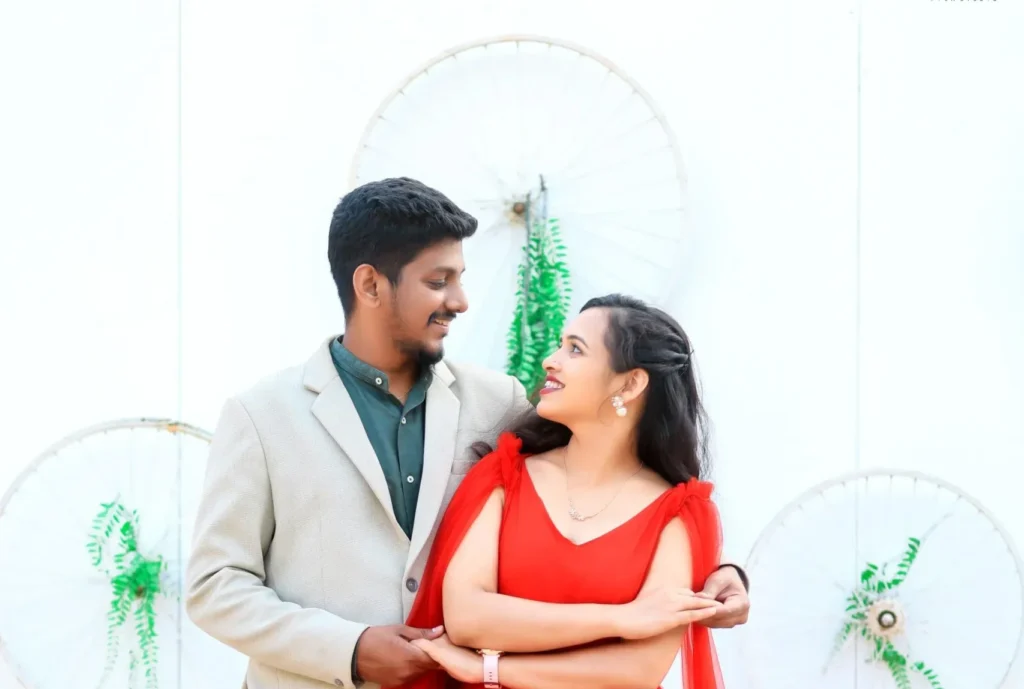 Bride in lehenga and groom in sherwani posing at Dream Town Film Studio