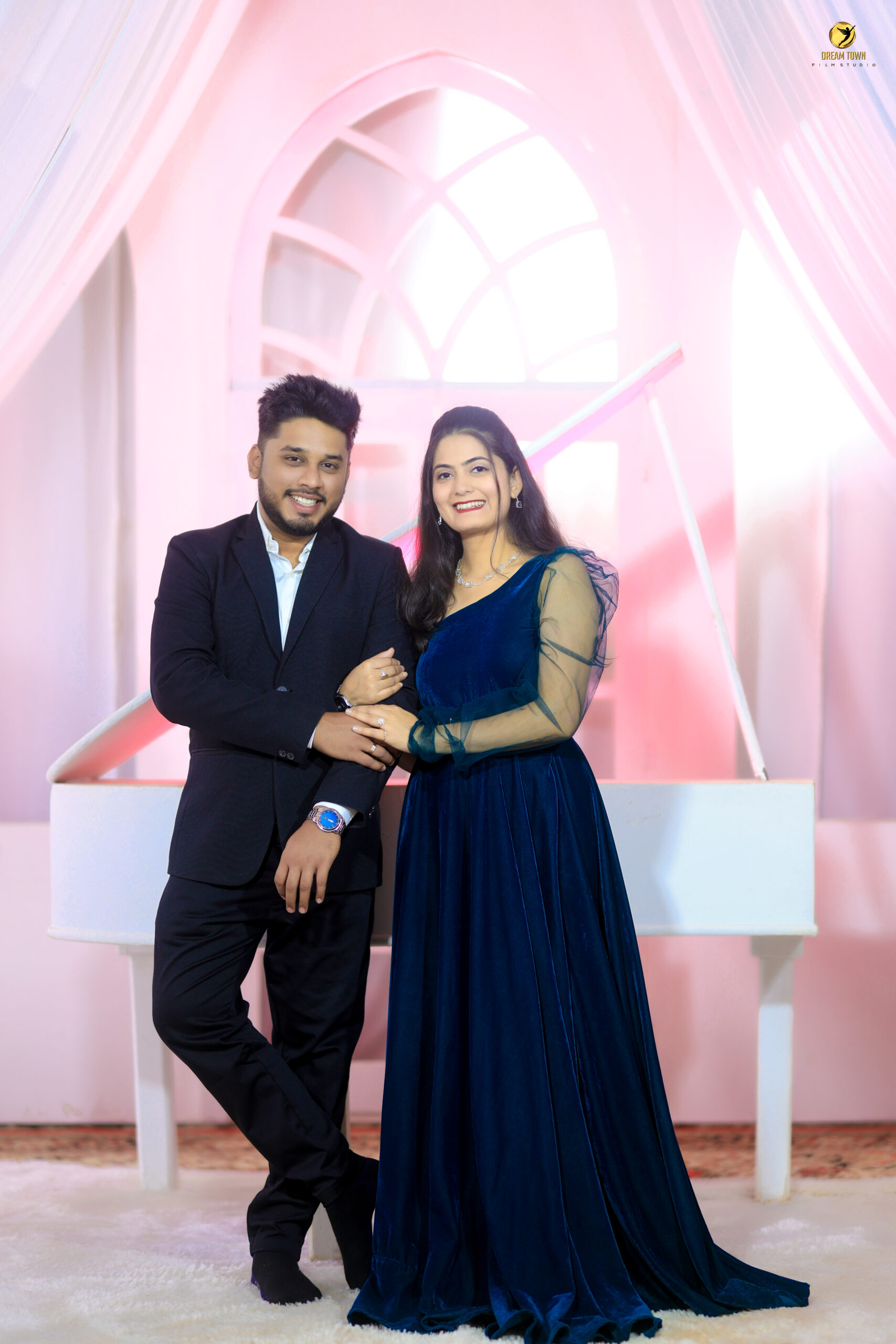 Romantic pre-wedding candid moment at photography studio in Pune