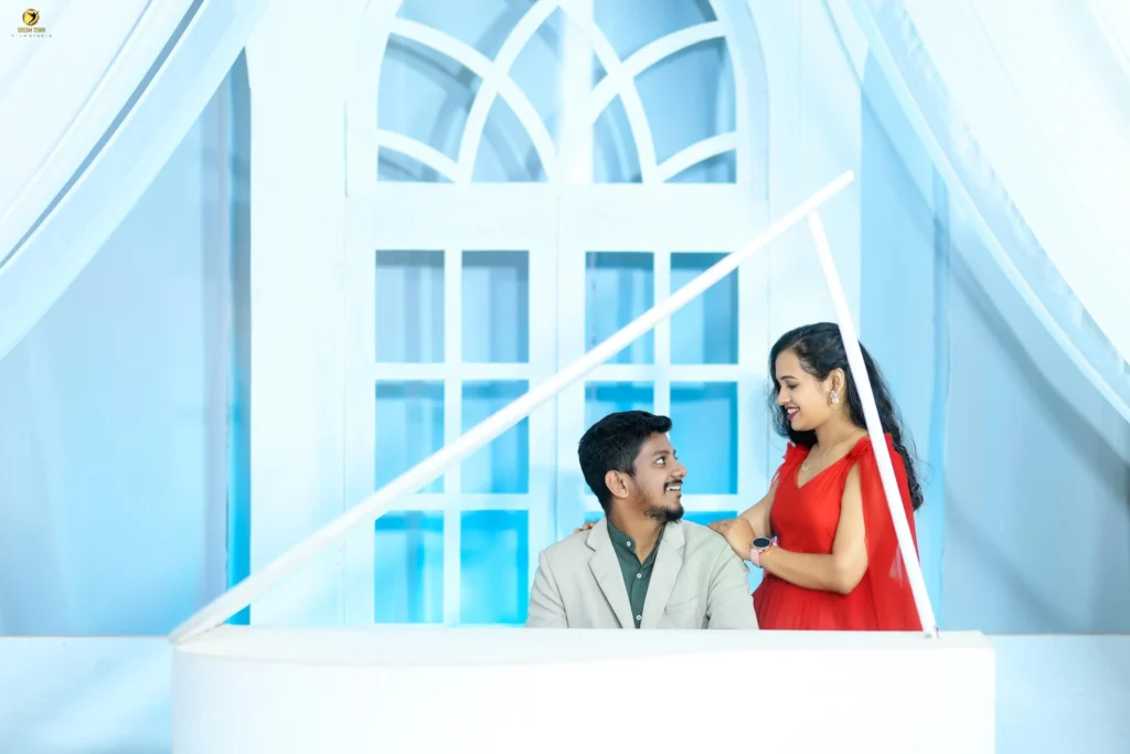 Bride in lehenga and groom in sherwani posing at Dream Town Film Studio