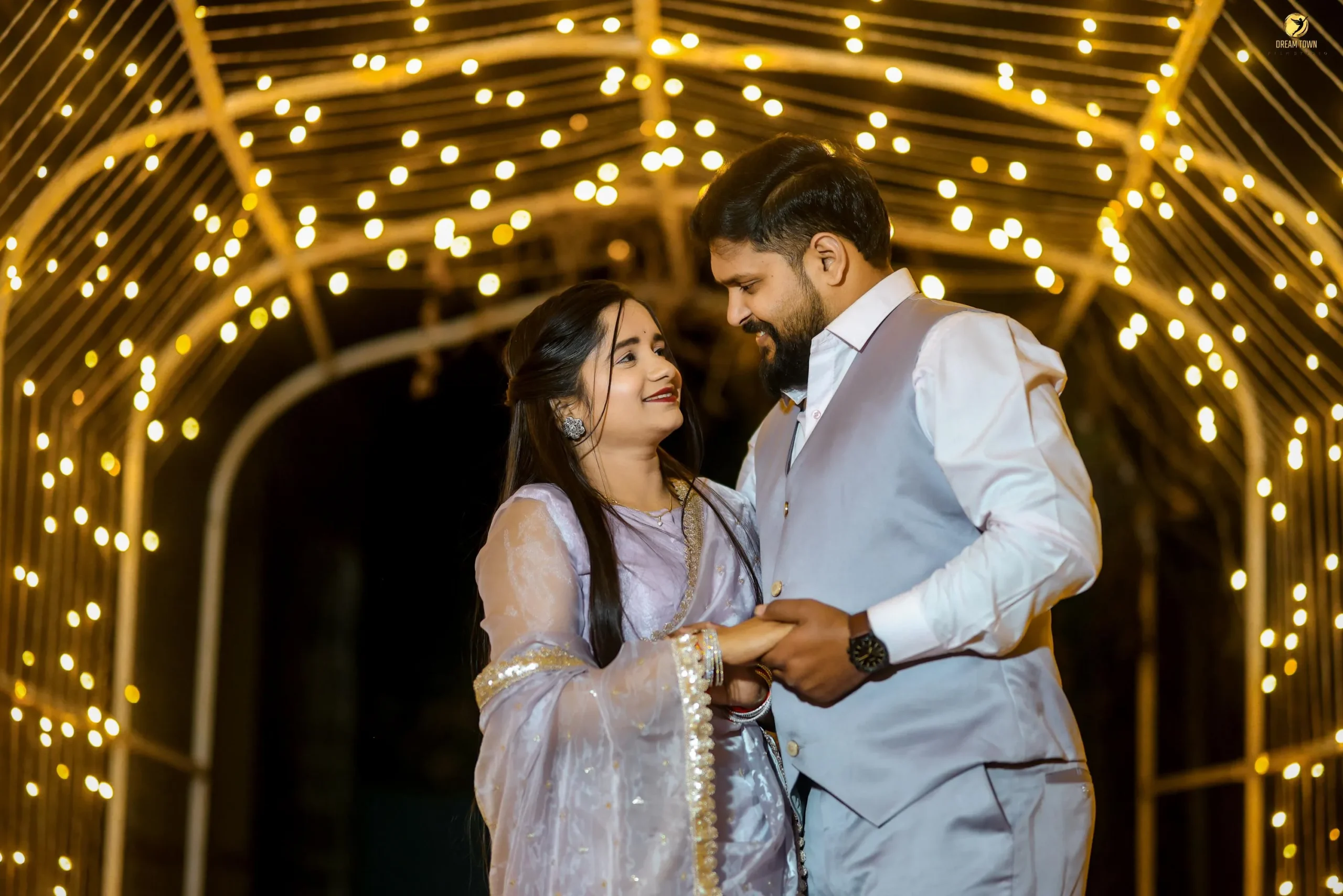 Romantic pre-wedding candid moment at photography studio in Pune