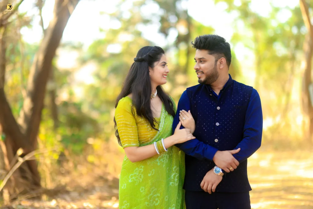 Bride in lehenga and groom in sherwani posing at Dream Town Film Studio