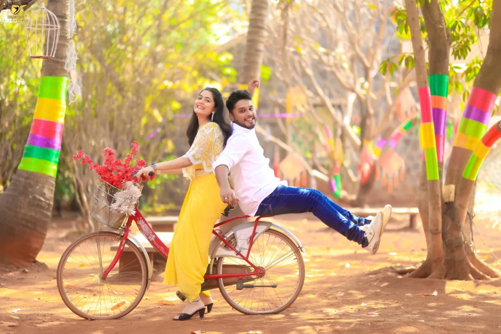 Bride in lehenga and groom in sherwani posing at Dream Town Film Studio